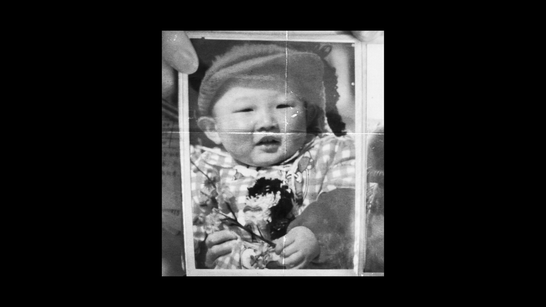 A black-and-white baby photograph from Don Chen's family story